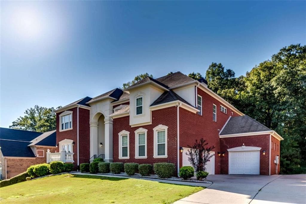 6 bedroom, 5 bathroom, 6,920 sq ft single family residence for sale at 4473 River Vista Road, Ellenwood, GA 30294 — photo 2