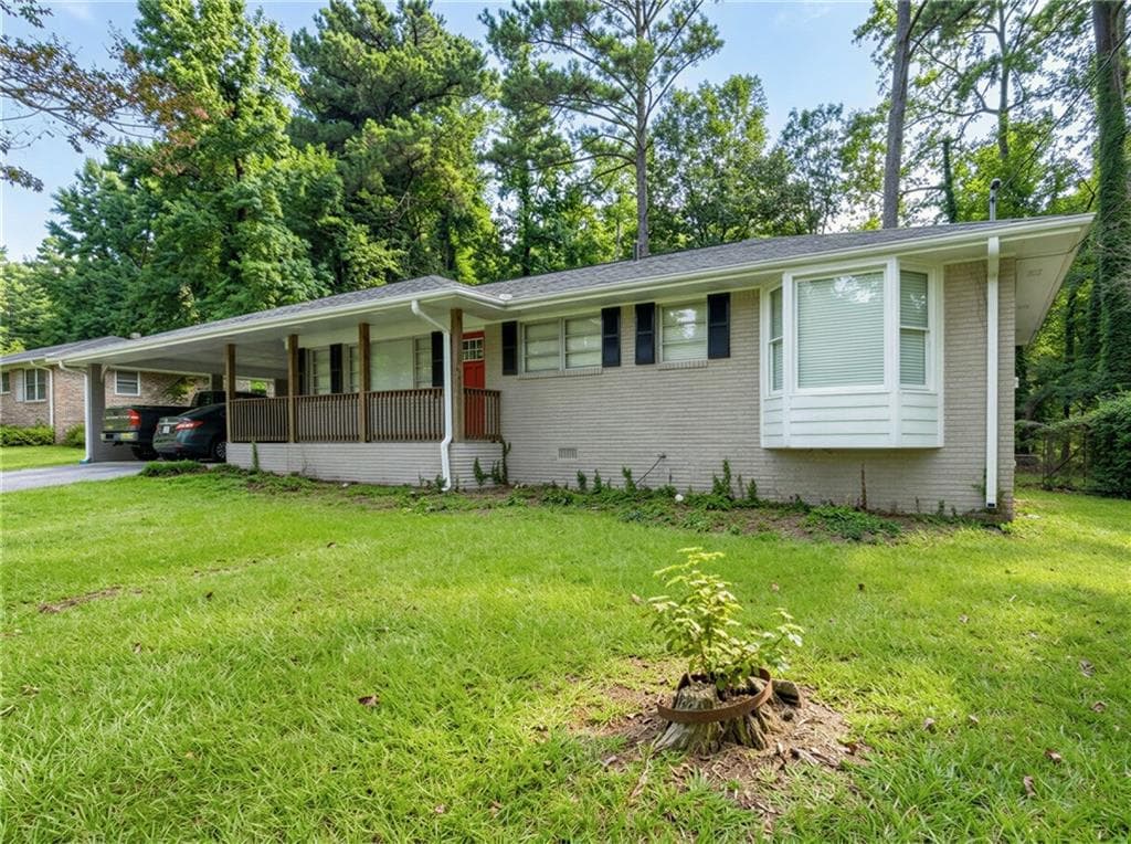 4 bedroom, 2 bathroom, 1,381 sq ft single family residence for sale at 6677 Songwood Drive, Austell, GA 30168 — photo 3