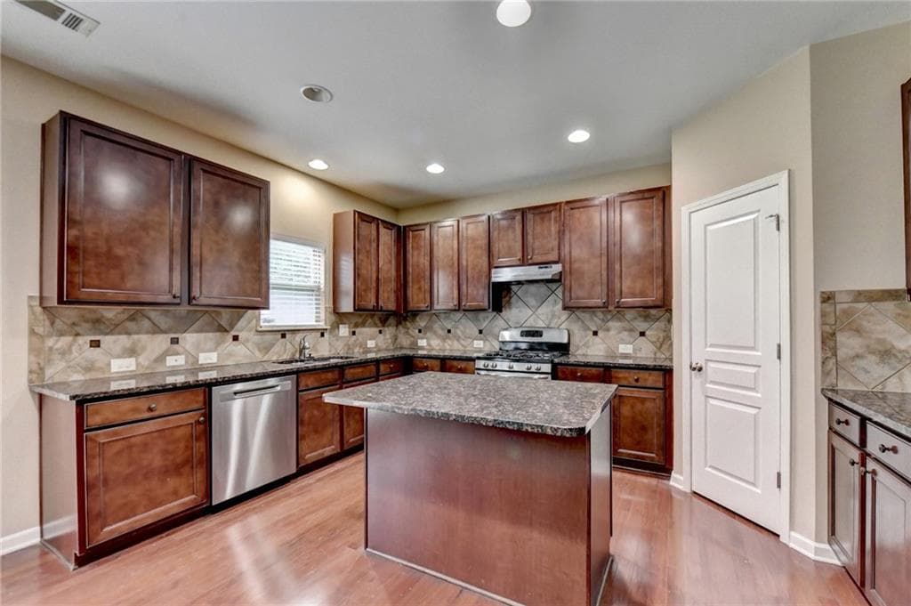 5 bedroom, 4 bathroom, 3,356 sq ft single family residence for sale at 4228 Woods Creek Lane, Suwanee, GA 30024 — photo 2