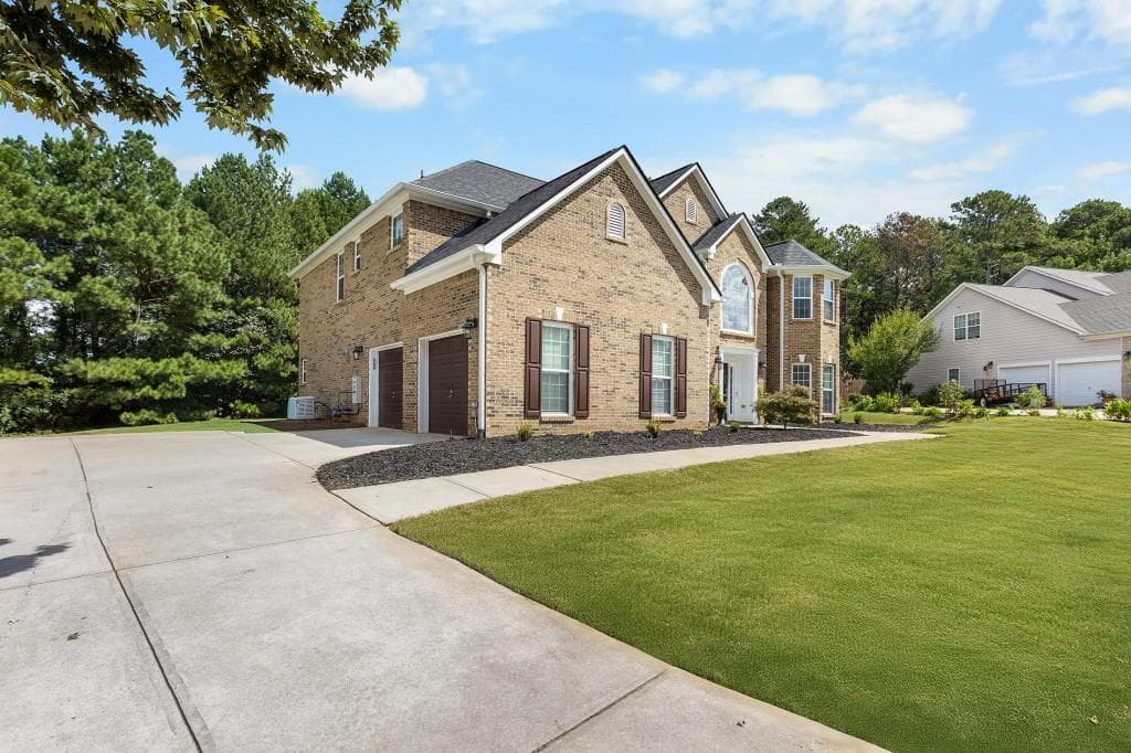 5 bedroom, 4 bathroom, 3,633 sq ft single family residence for sale at 1316 Darian Lane, Locust Grove, GA 30248 — photo 4