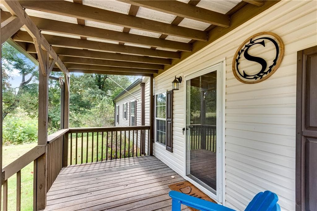 4 bedroom, 2 bathroom, 2,052 sq ft single family residence for sale at 4353 Flatbottom Road, Ball Ground, GA 30107 — photo 4