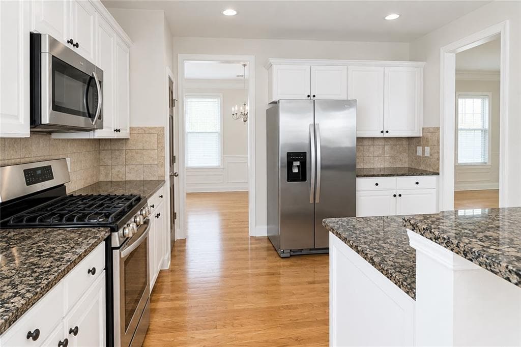 4 bedroom, 4 bathroom, 2,580 sq ft single family residence for sale at 3538 Old Towne Lane, Cumming, GA 30040 — photo 4