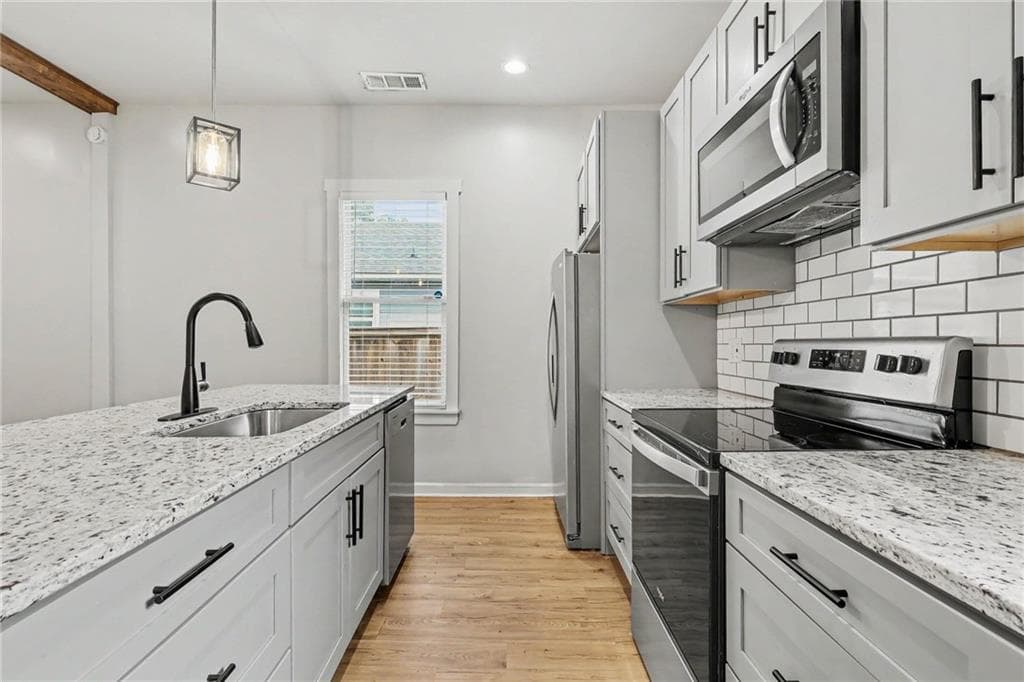 3 bedroom, 2 bathroom, 1,405 sq ft single family residence for sale at 31 Mildred Place NW, Atlanta, GA 30318 — photo 4