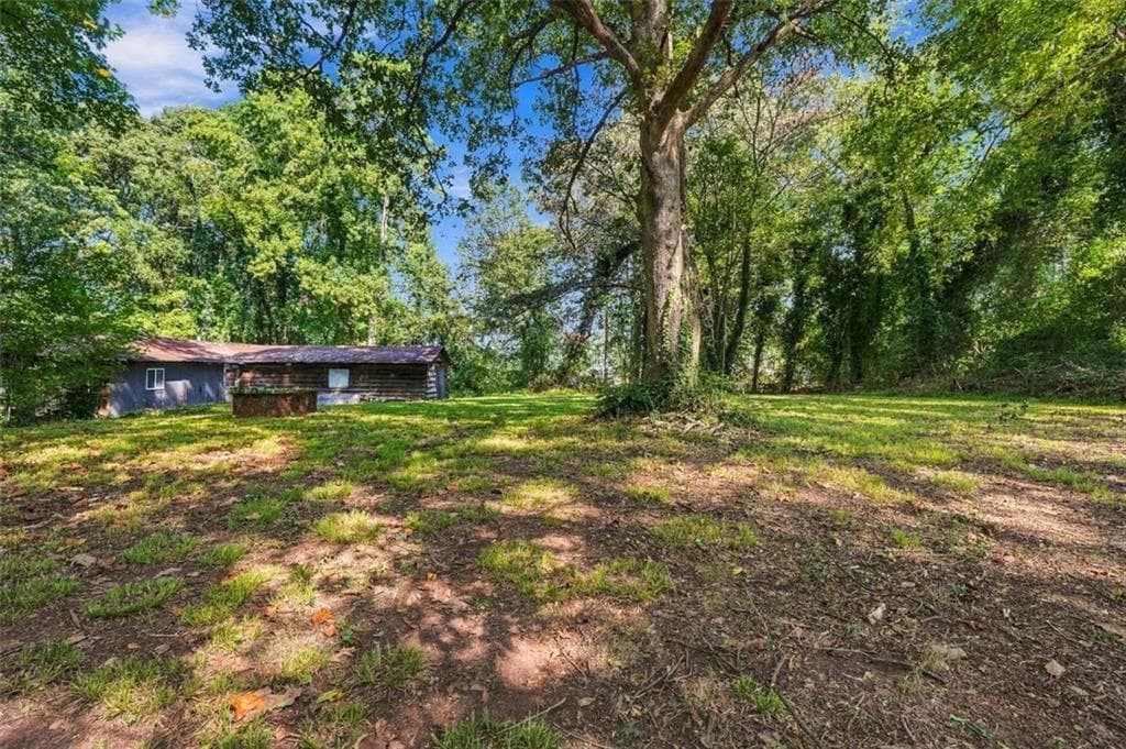 4 bedroom, 1 bathroom, 1,290 sq ft single family residence for sale at 5884 Rockbridge Road, Stone Mountain, GA 30087 — photo 4