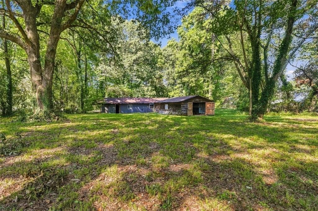 4 bedroom, 1 bathroom, 1,290 sq ft single family residence for sale at 5884 Rockbridge Road, Stone Mountain, GA 30087 — photo 5