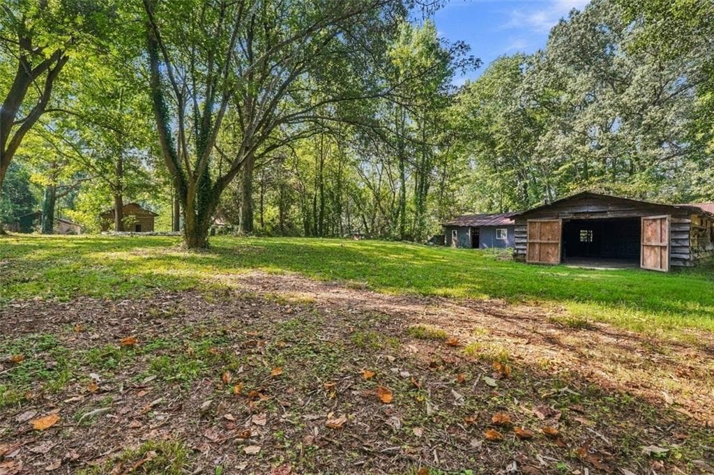 4 bedroom, 1 bathroom, 1,290 sq ft single family residence for sale at 5884 Rockbridge Road, Stone Mountain, GA 30087 — photo 6