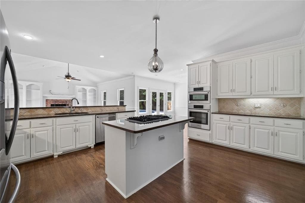5 bedroom, 5 bathroom, 6,258 sq ft single family residence for sale at 4400 Sirrocco Lane, Lilburn, GA 30047 — photo 6