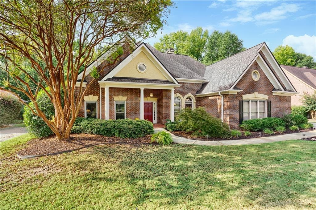 4 bedroom, 4 bathroom, 3,167 sq ft single family residence for sale at 7040 Grassmoor Grange Way, Cumming, GA 30040 — photo 2