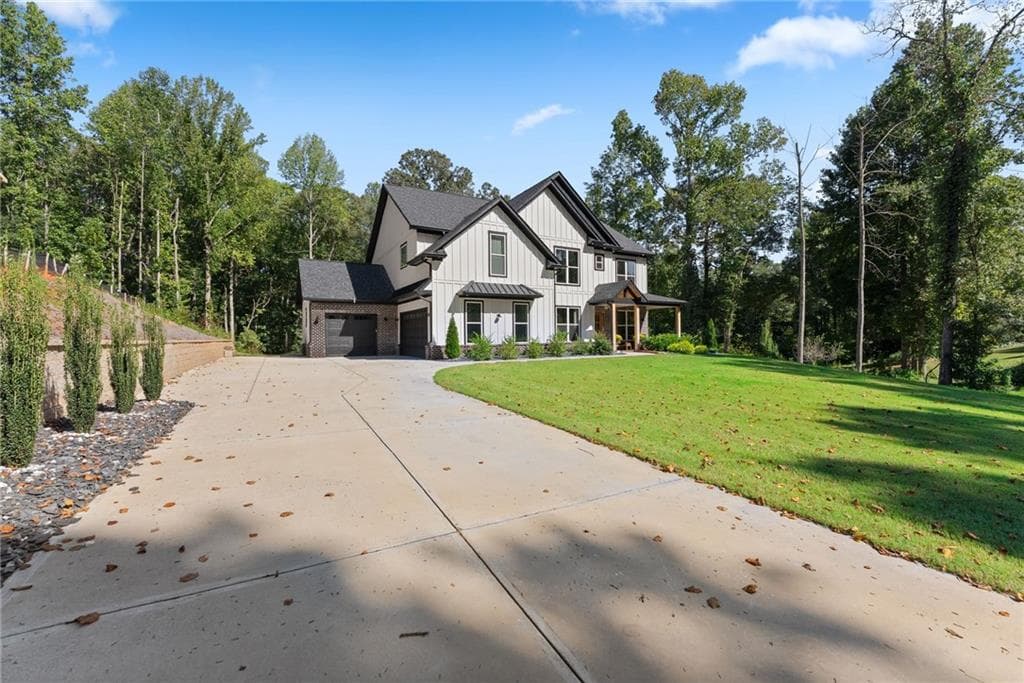 5 bedroom, 4 bathroom, 4,537 sq ft single family residence for sale at 1144 Lexington Ridge Road, Hoschton, GA 30548 — photo 3