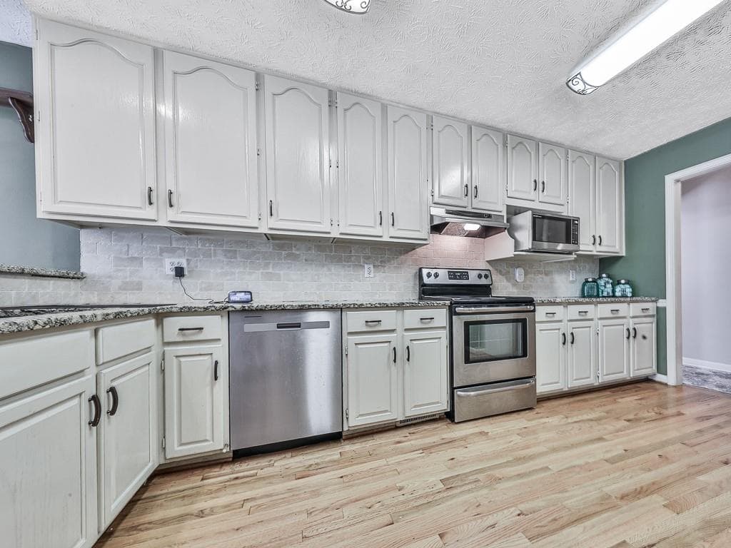 5 bedroom, 3 bathroom, 4,687 sq ft single family residence for sale at 6534 Cartersville Highway, Dallas, GA 30132 — photo 4