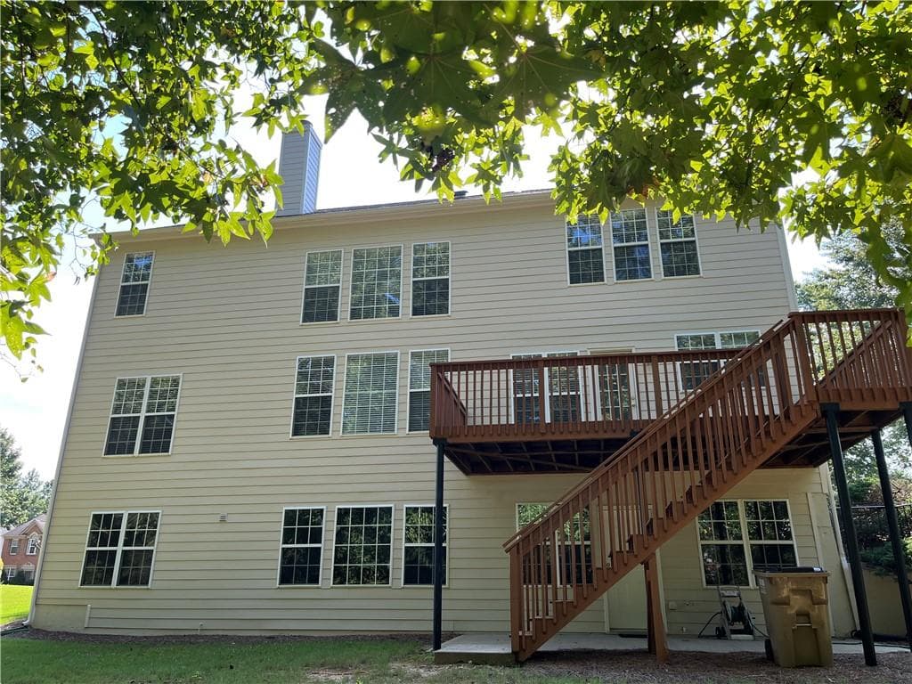 5 bedroom, 3 bathroom, 2,734 sq ft single family residence for sale at 555 Midhurst Place, Johns Creek, GA 30024 — photo 4
