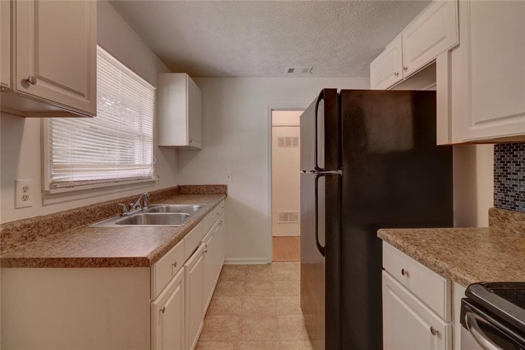 3 bedroom, 2 bathroom, 1,456 sq ft single family residence for sale at 4749 Lost Colony Court, Stone Mountain, GA 30088 — photo 7