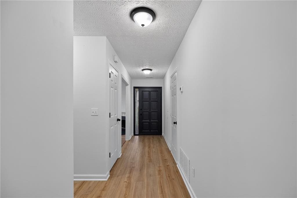 3 bedroom, 2 bathroom, 1,334 sq ft single family residence for sale at 1555 Burnstone Drive, Stone Mountain, GA 30088 — photo 4