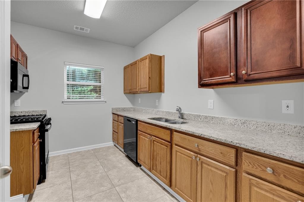 4 bedroom, 3 bathroom, 1,880 sq ft single family residence for sale at 2407 Hackamore Drive, South Fulton, GA 30349 — photo 10