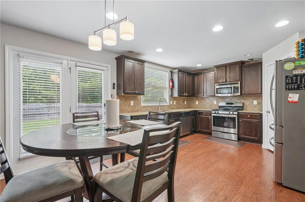 5 bedroom, 3 bathroom, 2,824 sq ft single family residence for sale at 1415 Union Station Court, Lawrenceville, GA 30045 — photo 6