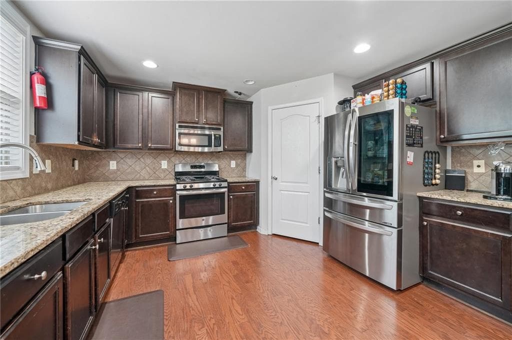 5 bedroom, 3 bathroom, 2,824 sq ft single family residence for sale at 1415 Union Station Court, Lawrenceville, GA 30045 — photo 8