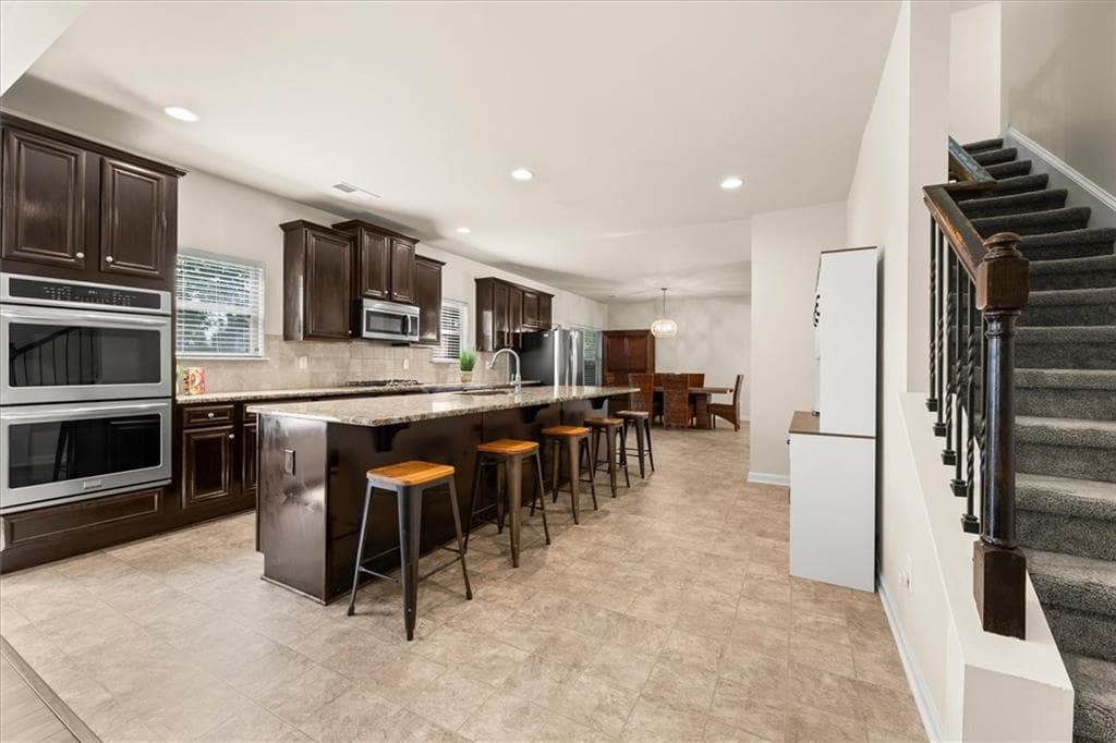6 bedroom, 5 bathroom, 3,733 sq ft single family residence for sale at 3594 Hideaway Lane, Loganville, GA 30052 — photo 7