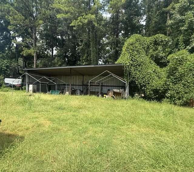 3 bedroom, 2 bathroom, 2,502 sq ft single family residence under contract at 5714 Hwy 42, Ellenwood, GA 30294 — photo 2