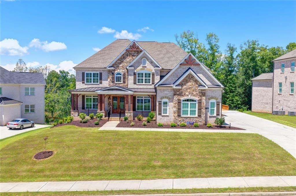 6 bedroom, 7 bathroom, 7,466 sq ft single family residence for sale at 7720 Wild Violet Drive, Cumming, GA 30040
