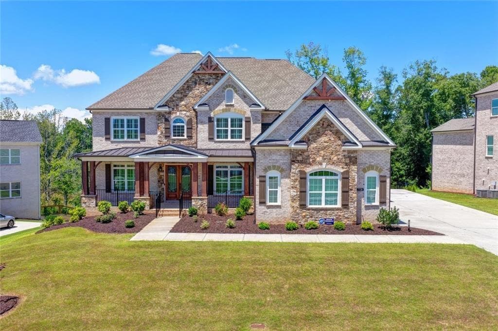 6 bedroom, 7 bathroom, 7,466 sq ft single family residence for sale at 7720 Wild Violet Drive, Cumming, GA 30040 — photo 2