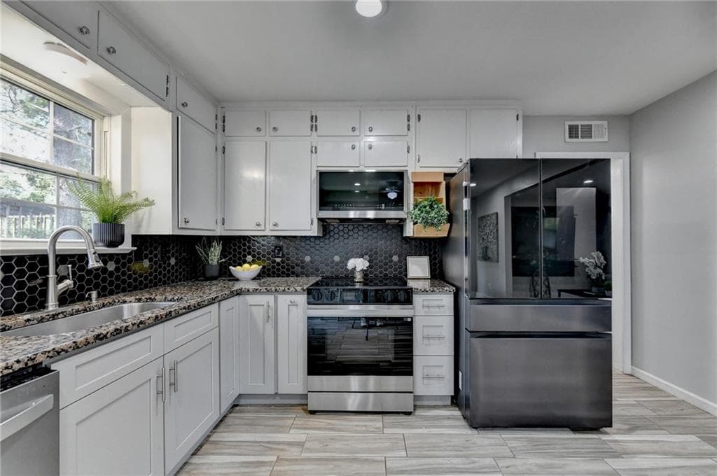 3 bedroom, 2 bathroom, 1,320 sq ft single family residence for sale at 4391 Bryant Drive, Lilburn, GA 30047 — photo 7