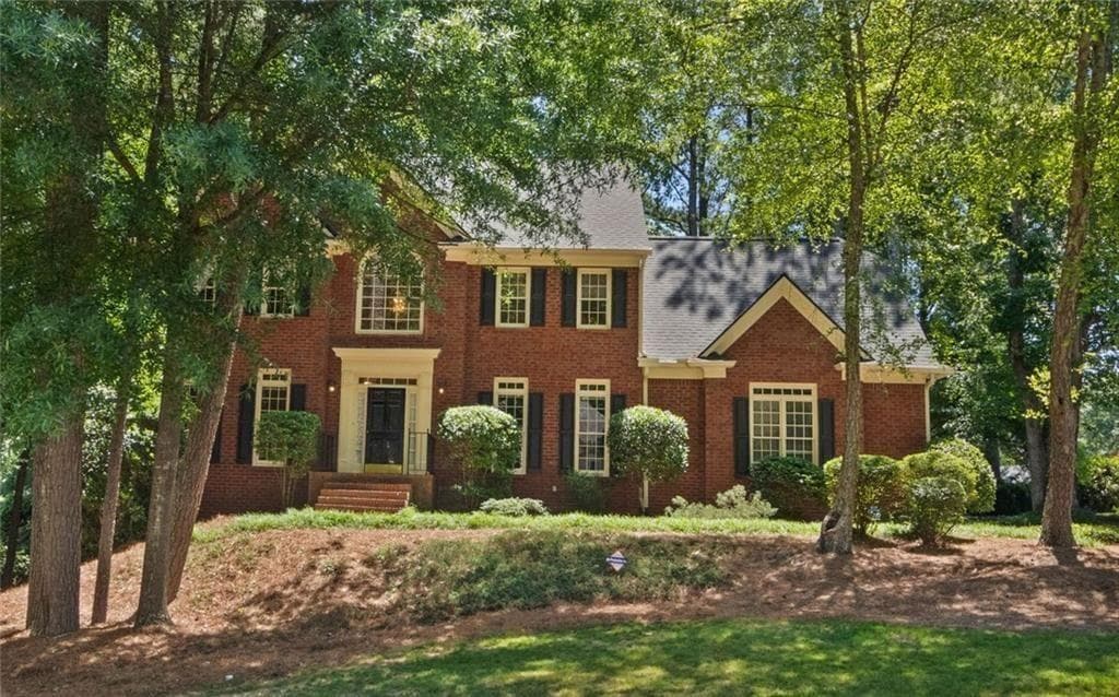5 bedroom, 4 bathroom, 4,046 sq ft single family residence for sale at 2010 Milfield Circle, Snellville, GA 30078 — photo 1 of 56