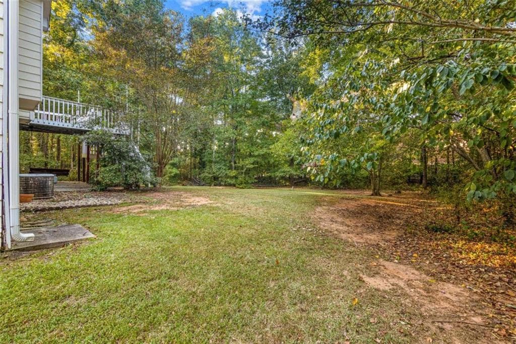 4 bedroom, 3 bathroom, 2,442 sq ft single family residence under contract at 215 Somerset Drive, Covington, GA 30016 — photo 2