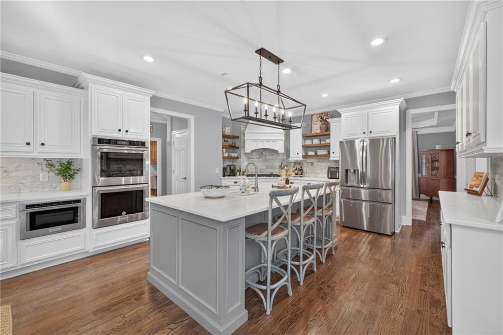 6 bedroom, 5 bathroom, 5,075 sq ft single family residence for sale at 3075 Corsair Curve, Cumming, GA 30040 — photo 10