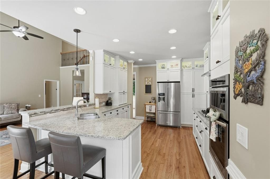 5 bedroom, 4 bathroom, 4,130 sq ft single family residence for sale at 5370 Avonshire Lane, Cumming, GA 30040 — photo 8