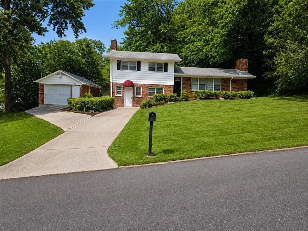 4 bedroom, 2 bathroom, 1,621 sq ft single family residence for sale at 1037 Mell Avenue, Clarkston, GA 30021 — photo 1 of 26