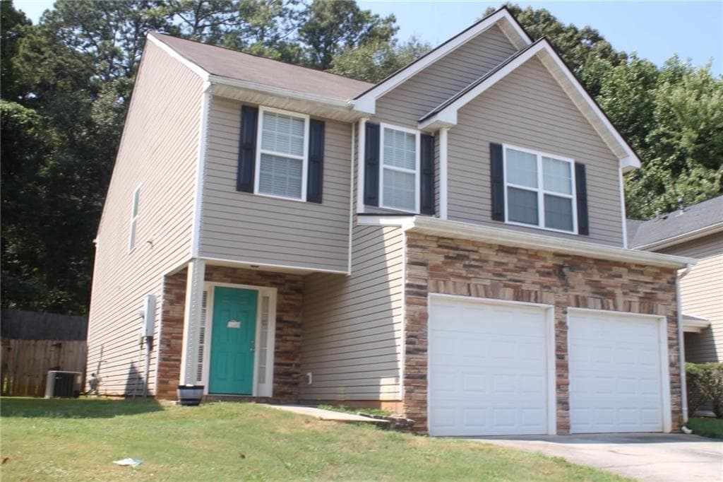 4 bedroom, 3 bathroom, 2,244 sq ft single family residence for sale at 7809 Newbury Drive, Jonesboro, GA 30236 — photo 2