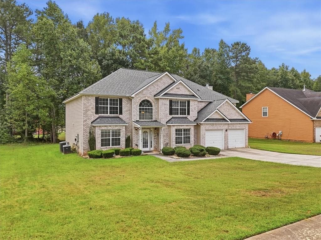 5 bedroom, 3 bathroom, 4,733 sq ft single family residence for sale at 145 Madisyn Drive, Hampton, GA 30228 — photo 2