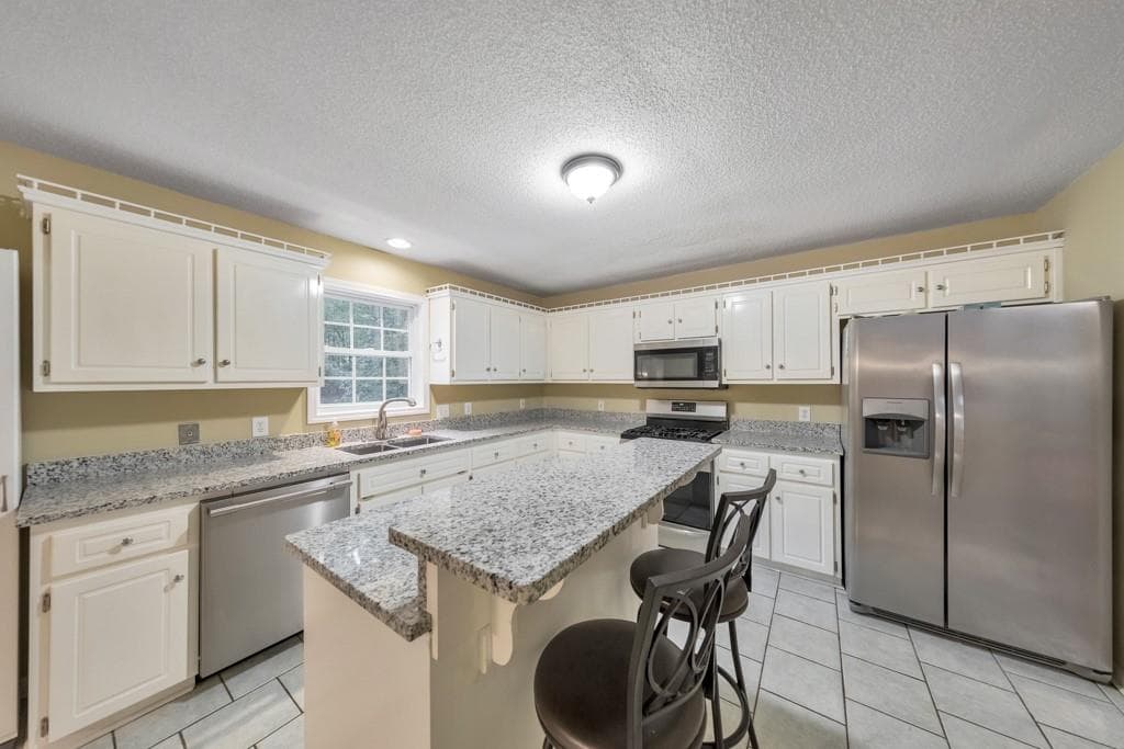 4 bedroom, 3 bathroom, 2,427 sq ft single family residence for sale at 315 Magnolia Drive, Canton, GA 30114 — photo 3