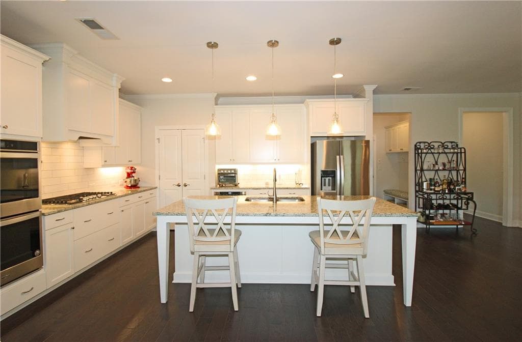 4 bedroom, 3 bathroom, 2,752 sq ft single family residence for sale at 1725 Nestledown Drive, Cumming, GA 30040 — photo 6