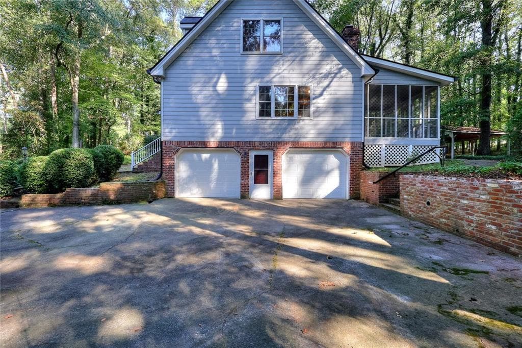 4 bedroom, 3 bathroom, 4,503 sq ft single family residence for sale at 1786 SW Bear Cave, Lilburn, GA 30047 — photo 2