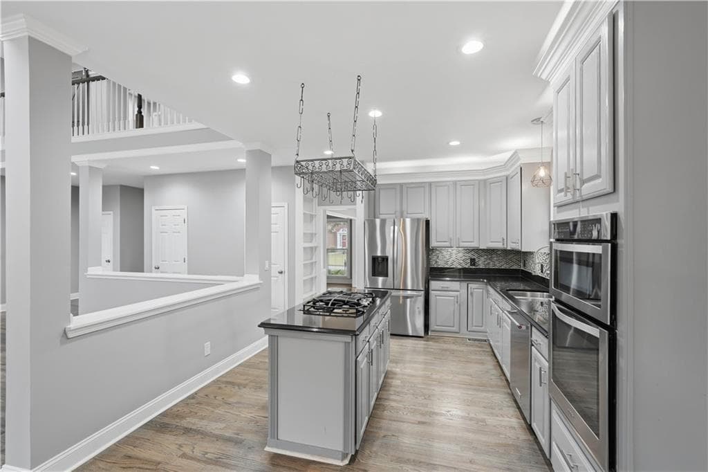6 bedroom, 4 bathroom, 3,117 sq ft single family residence for sale at 160 Treadstone Overlook, Suwanee, GA 30024 — photo 10