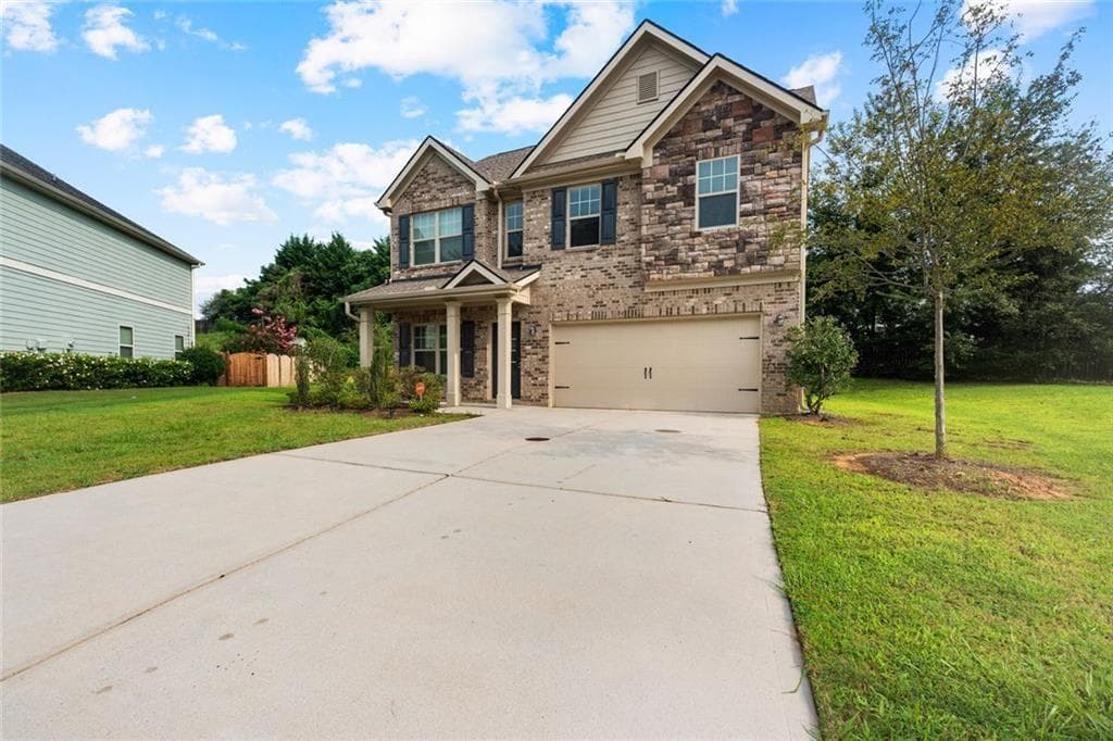 4 bedroom, 3 bathroom, 1,955 sq ft single family residence for sale at 7974 Granmore Court, Lithia Springs, GA 30122 — photo 2