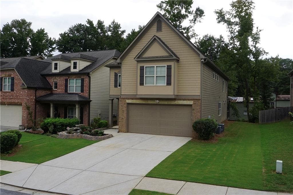4 bedroom, 3 bathroom, 2,722 sq ft single family residence for sale at 2618 Lake Manor Circle, Duluth, GA 30096 — photo 2