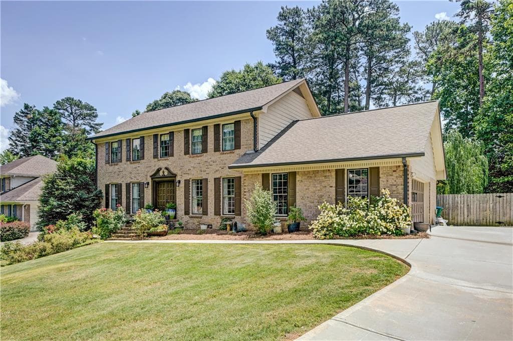4 bedroom, 3 bathroom, 3,406 sq ft single family residence for sale at 4414 Dunriver Drive, Lilburn, GA 30047 — photo 2