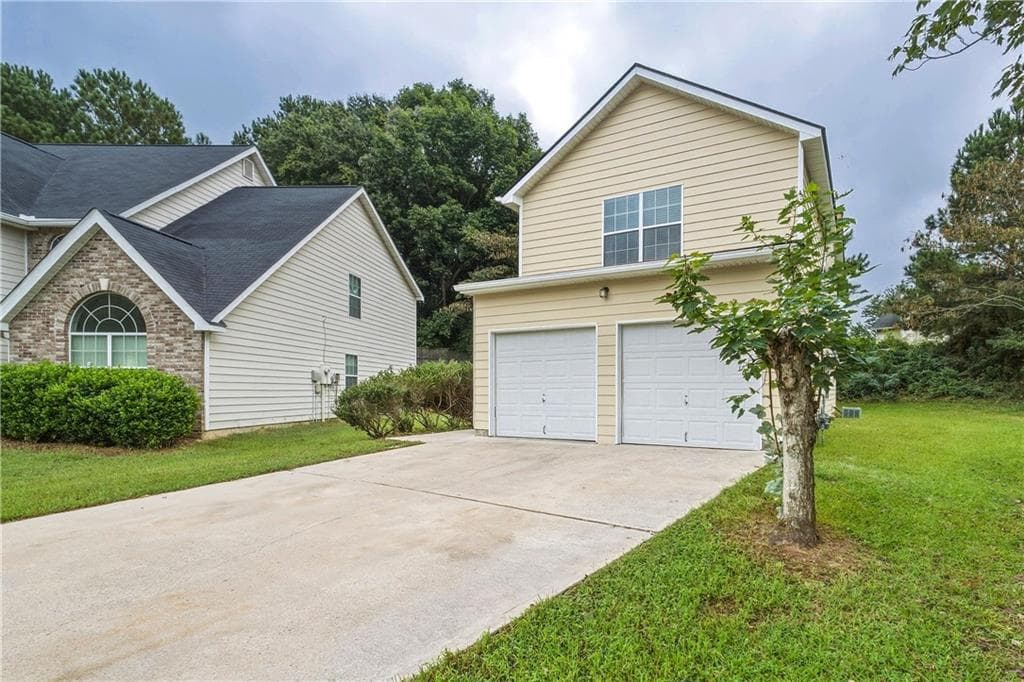 4 bedroom, 3 bathroom, 2,024 sq ft single family residence for sale at 2376 Creel Road, Atlanta, GA 30349 — photo 2