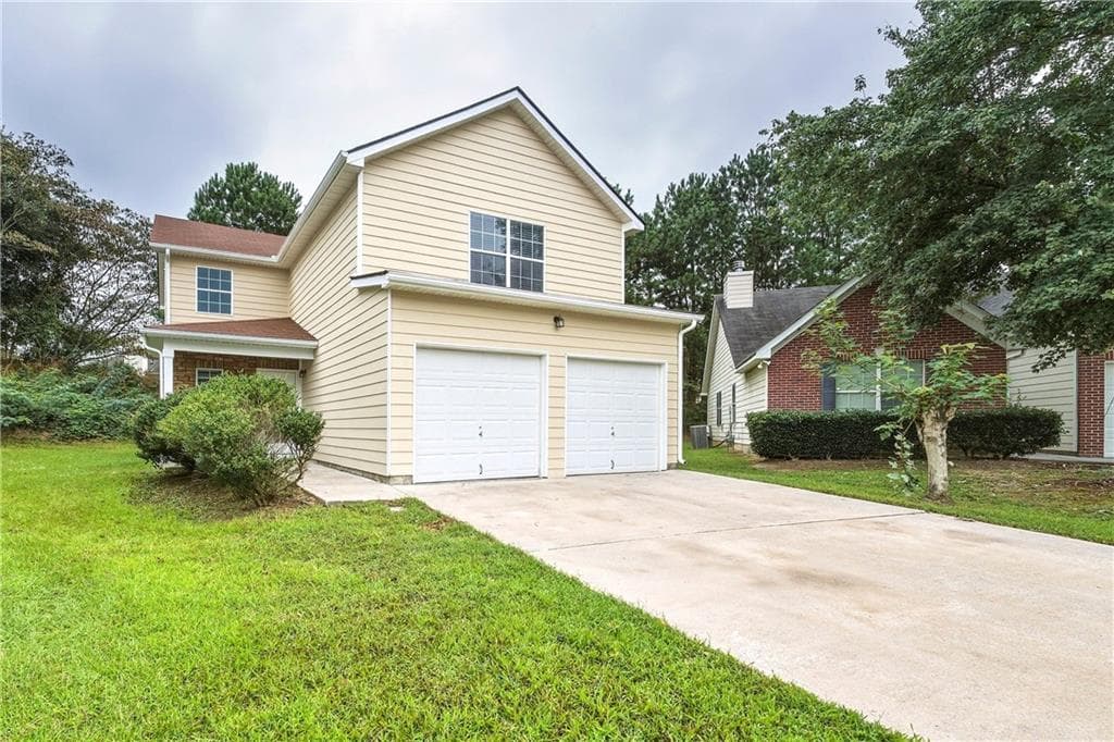 4 bedroom, 3 bathroom, 2,024 sq ft single family residence for sale at 2376 Creel Road, Atlanta, GA 30349 — photo 3