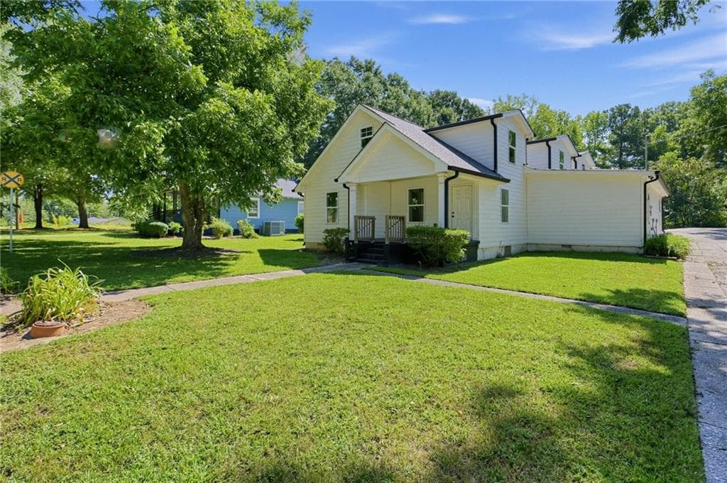 5 bedroom, 4 bathroom, 3,738 sq ft single family residence for sale at 134 E 5th Street, Monroe, GA 30655