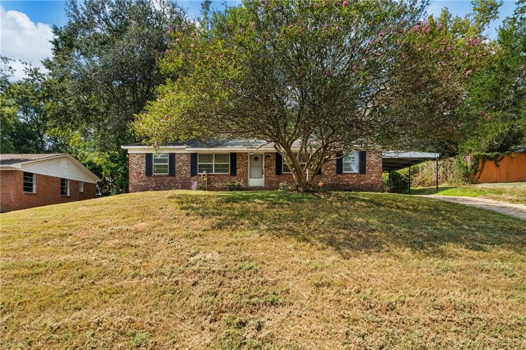 4 bedroom, 2 bathroom, 1,377 sq ft single family residence for sale at 1409 Melford Drive, Columbus, GA 31907 — photo 2