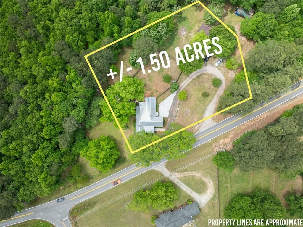 4 bedroom, 3 bathroom, 1,921 sq ft single family residence for sale at 1519 New Hope Church Road, Loganville, GA 30052 — photo 2