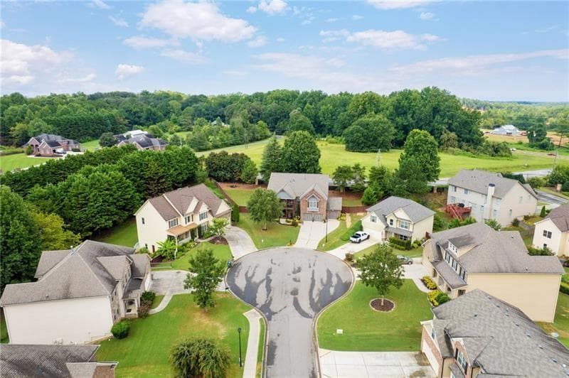 7 bedroom, 5 bathroom, 5,350 sq ft single family residence for sale at 4665 Osprey Court, Cumming, GA 30040 — photo 6