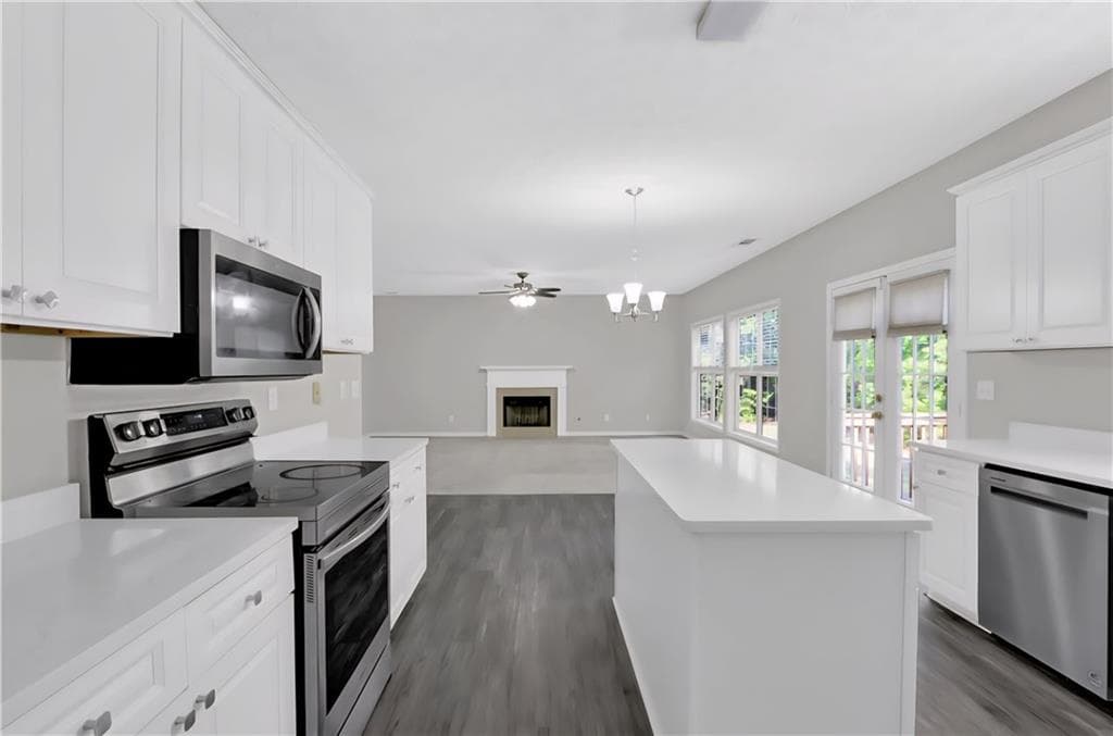 5 bedroom, 4 bathroom, 4,019 sq ft single family residence for sale at 1403 Elderberry Run Cove, Lawrenceville, GA 30043 — photo 5