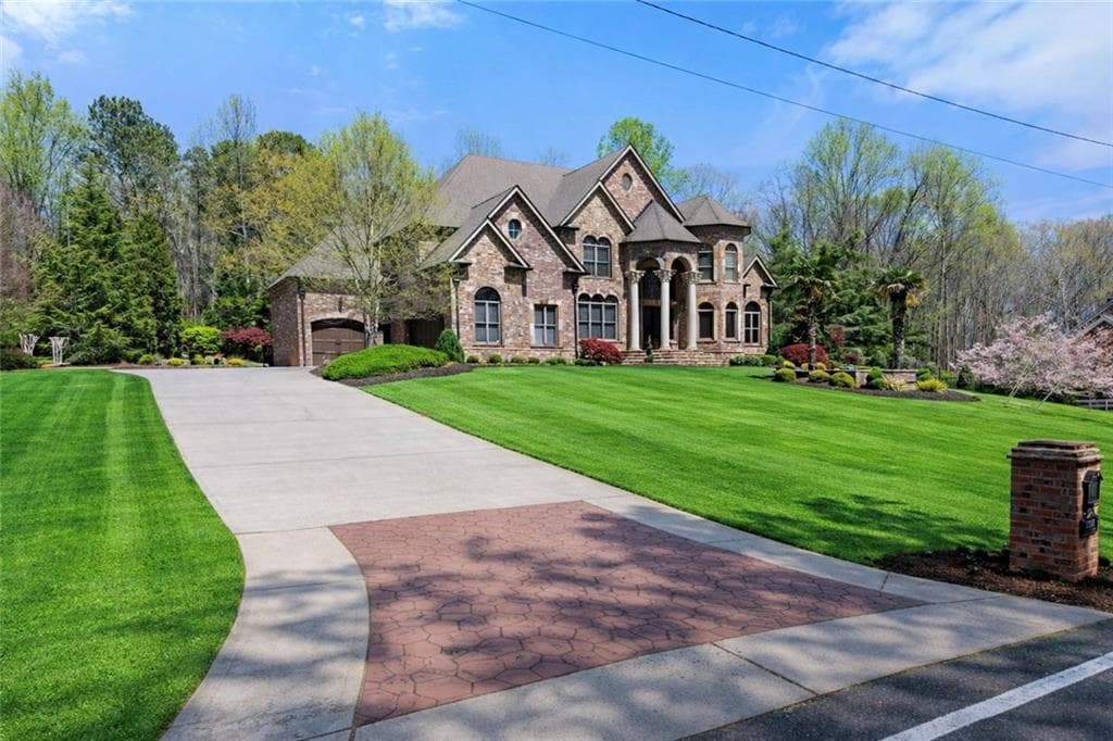 6 bedroom, 9 bathroom, 8,100 sq ft single family residence for sale at 1310 Settles Road, Suwanee, GA 30024