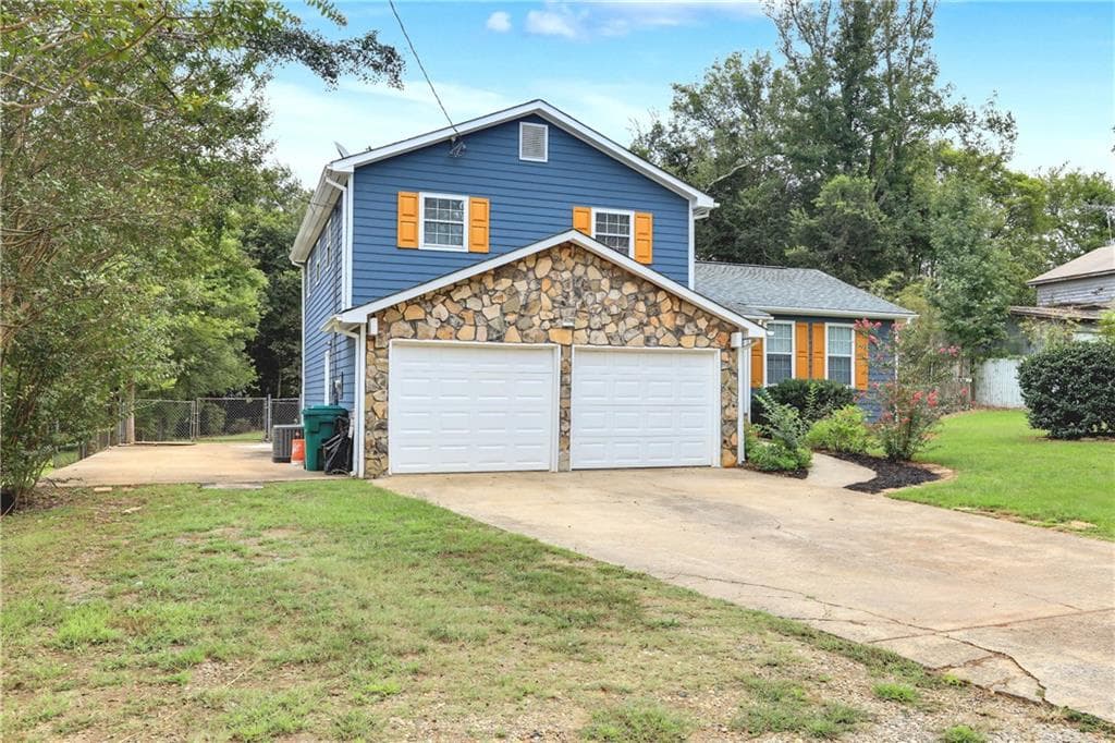 3 bedroom, 2 bathroom, 1,304 sq ft single family residence for sale at 3447 Trickum Road, Woodstock, GA 30188 — photo 2