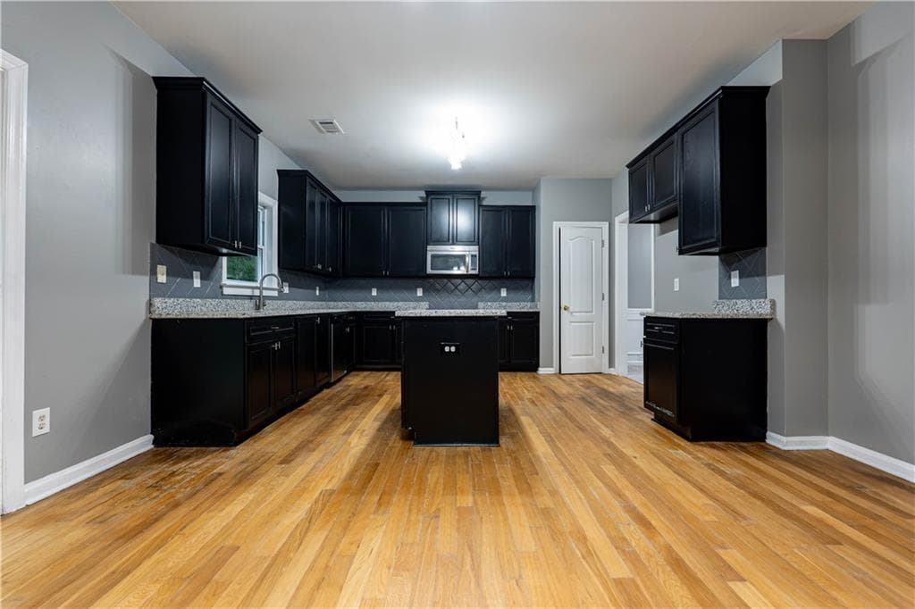 7 bedroom, 4 bathroom, 4,130 sq ft single family residence for sale at 1933 Temple Park Drive, Loganville, GA 30052 — photo 8
