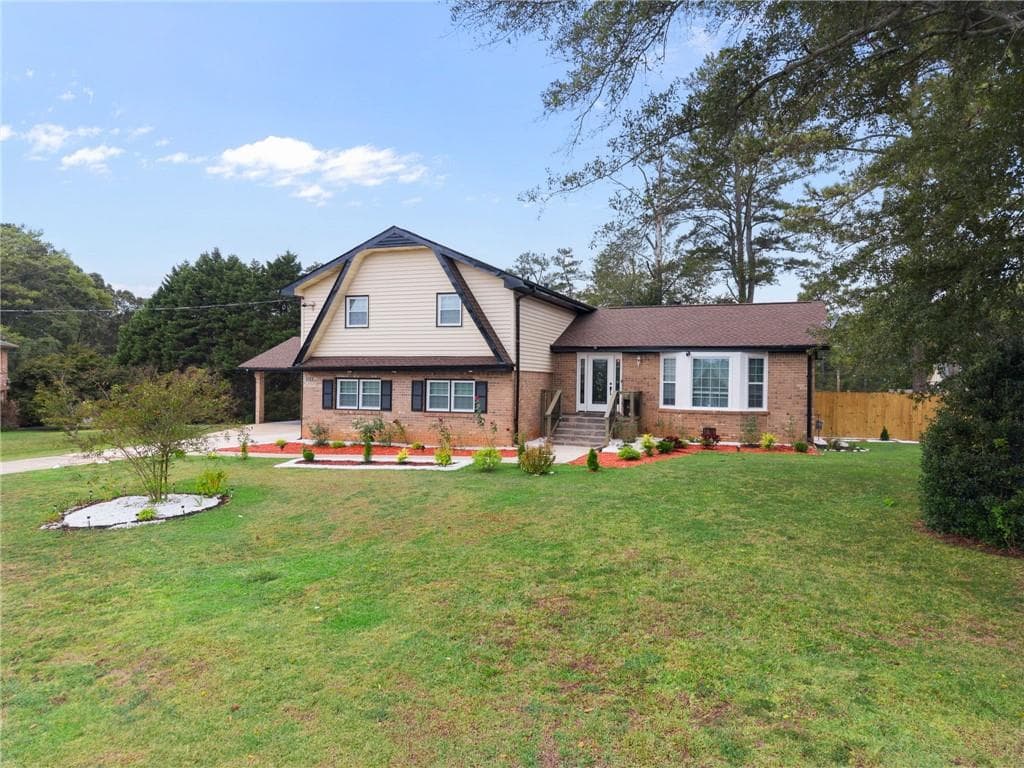 4 bedroom, 3 bathroom, 2,174 sq ft single family residence for sale at 5083 Flakes Mill Road, Ellenwood, GA 30294 — photo 2